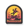 Decorative magnet with a horse and two people on a sunset background, featuring the word 'Maharashtra'.