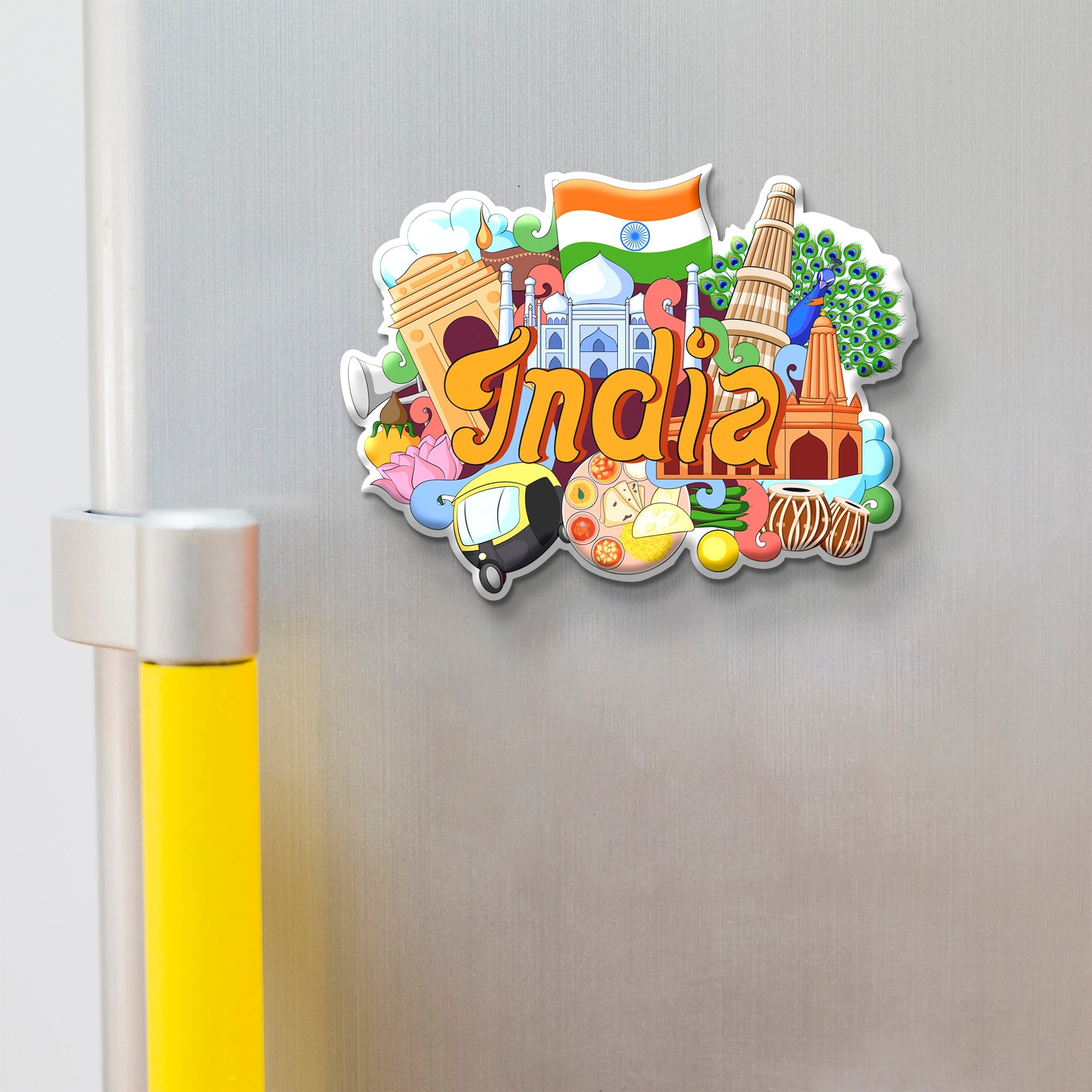 Colorful 'India' magnet with various symbols on a metallic surface