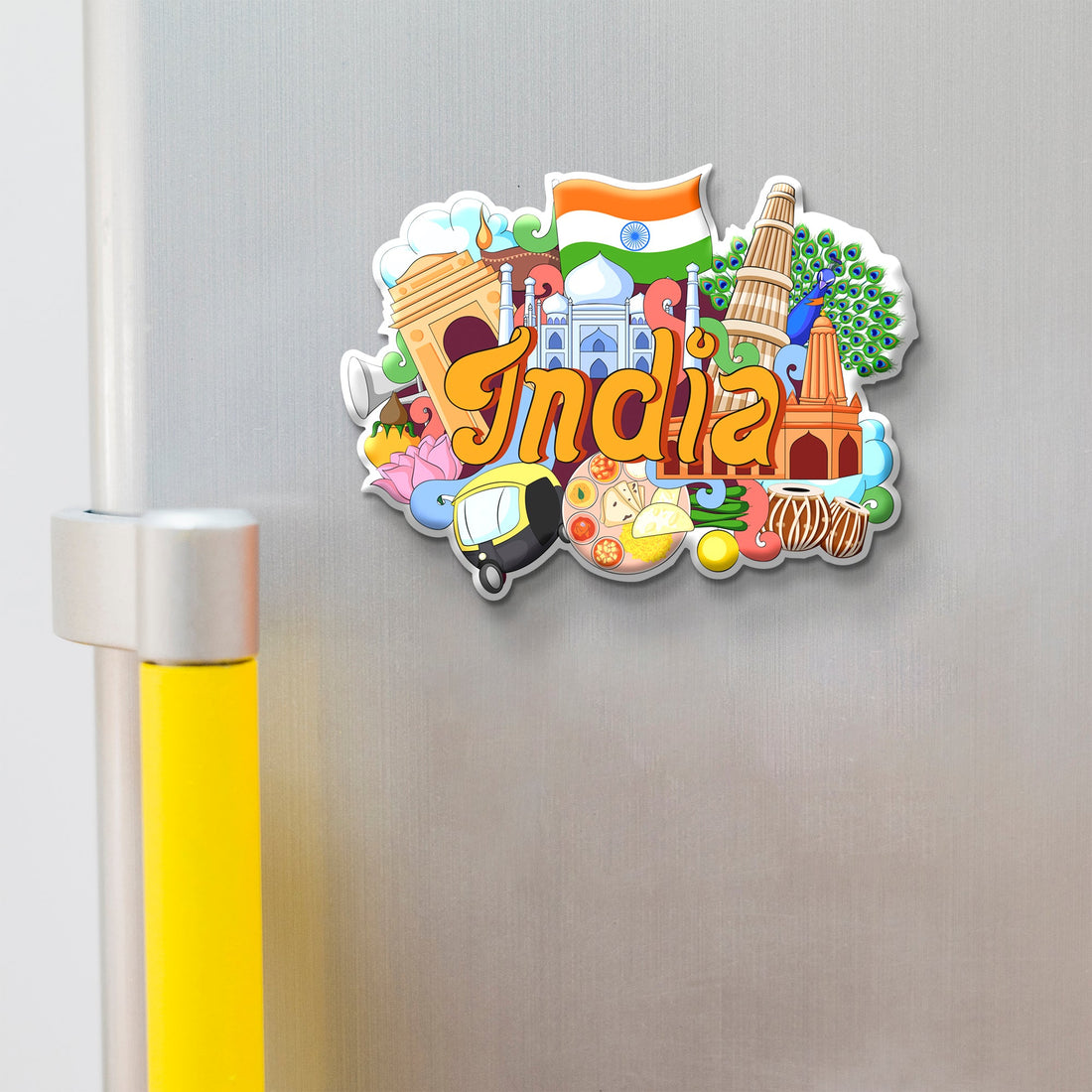 Colorful 'India' magnet with various symbols on a metallic surface